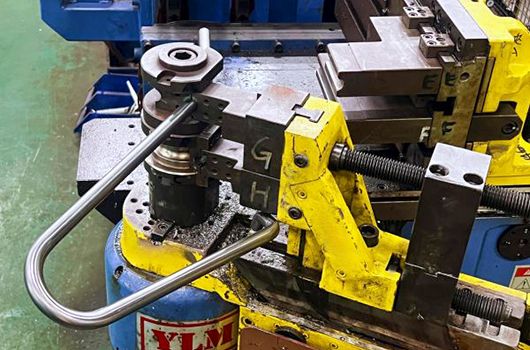 Pipe bending machine shaping steel tubes with precision for custom metal components
